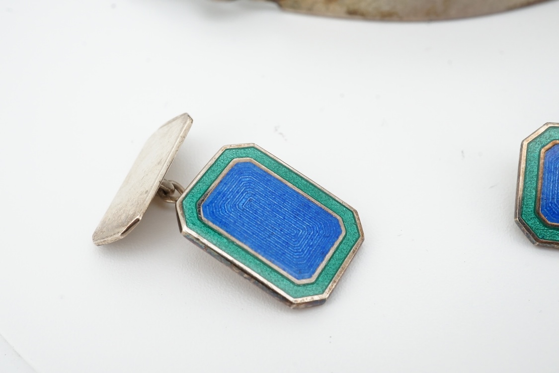 A 1970's silver identity bracelet and a modern pair of silver and two colour enamel cufflinks.